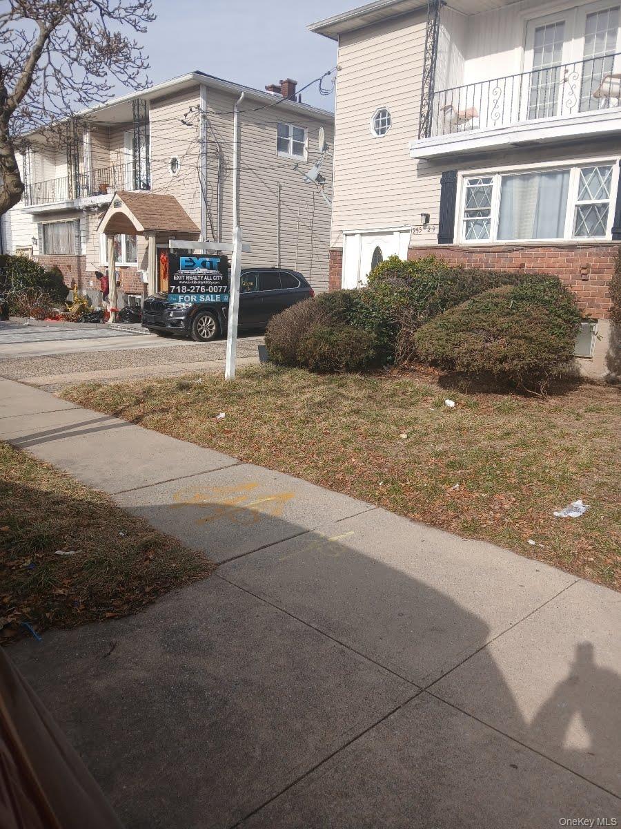 255-29 149th Road Queens, NY 11422 - Photo 4 of 23 a front view of a house with a yard