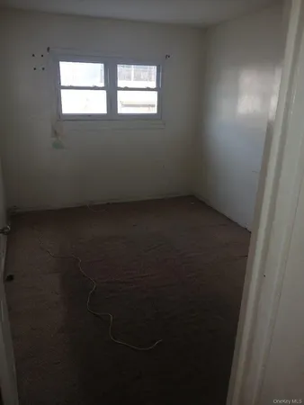a view of a room that has a window in it