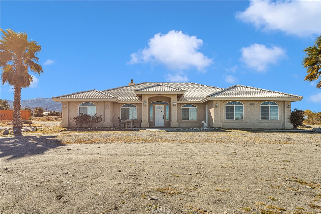 3485 Smoke Tree Road Phelan, CA 92371 - Photo 1 of 1 a front view of a house with a yard