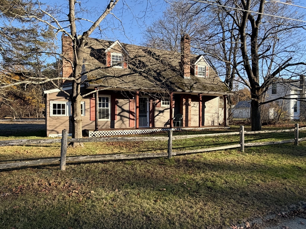 130 Laurel Street Greenfield, MA 01301 - Photo 1 of 31 a view of a house with a large tree and wooden fence