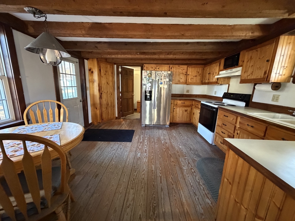 130 Laurel Street Greenfield, MA 01301 - Photo 12 of 31 a view of living room kitchen with furniture and wooden floor