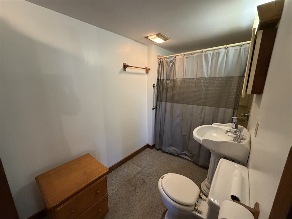 130 Laurel Street Greenfield, MA 01301 - Photo 13 of 31 a bathroom with a sink mirror and toilet