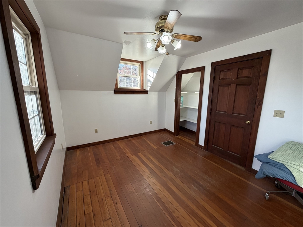 130 Laurel Street Greenfield, MA 01301 - Photo 21 of 31 a view of an empty room with wooden floor and a window