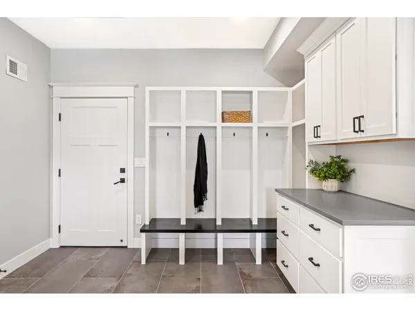 a view of an entryway with wooden floor