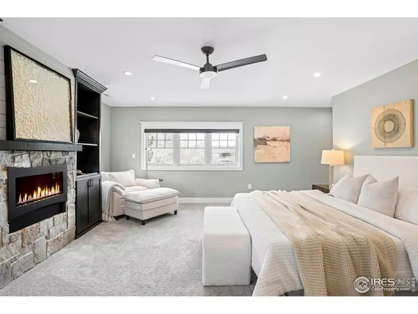 a bedroom with a bed couch and window