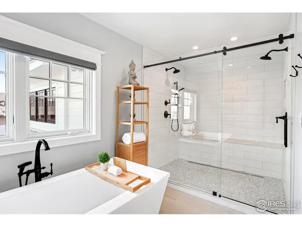 a bathroom with a bathtub and a shower