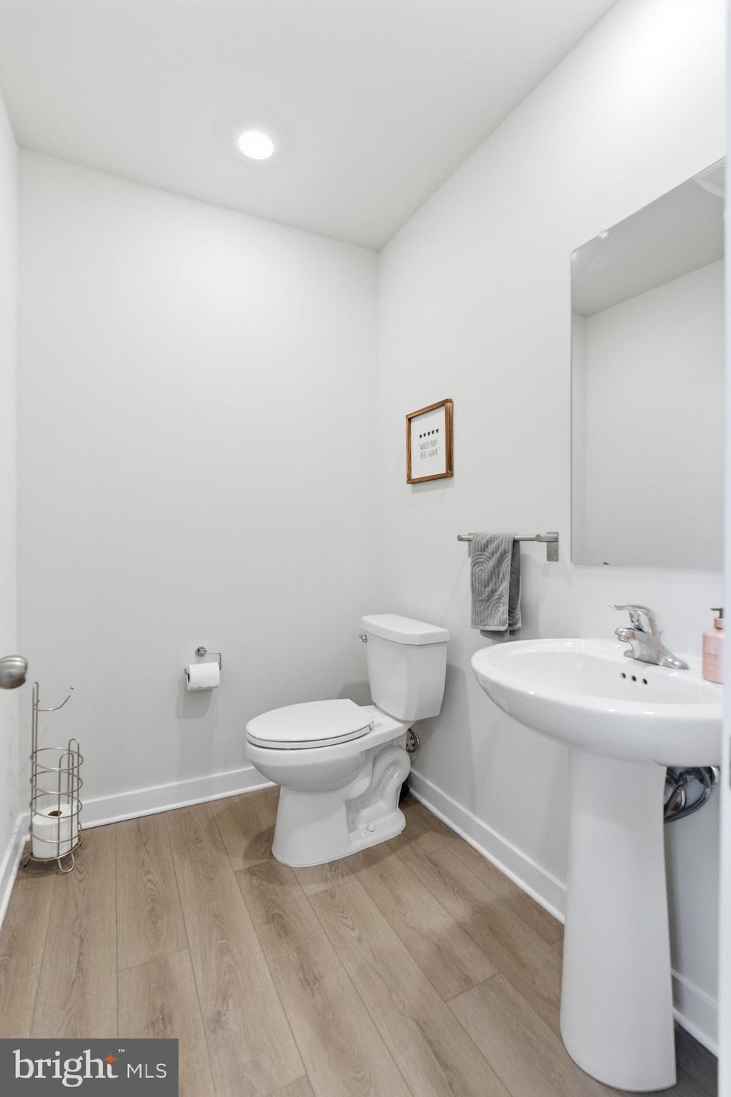 65 East Front Street Bridgeport, PA 19405 - Photo 24 of 49 a bathroom with a sink a toilet and a mirror