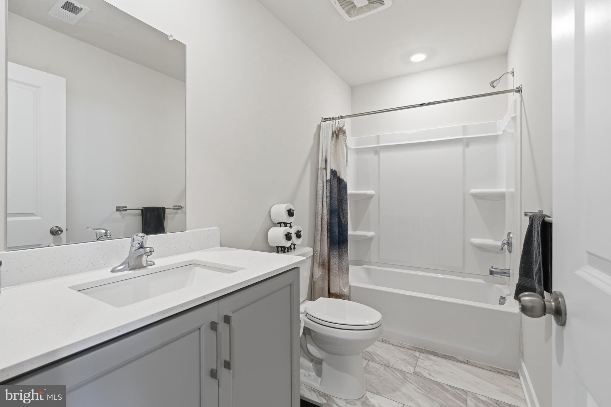 65 East Front Street Bridgeport, PA 19405 - Photo 37 of 49 a bathroom with a sink a toilet and shower