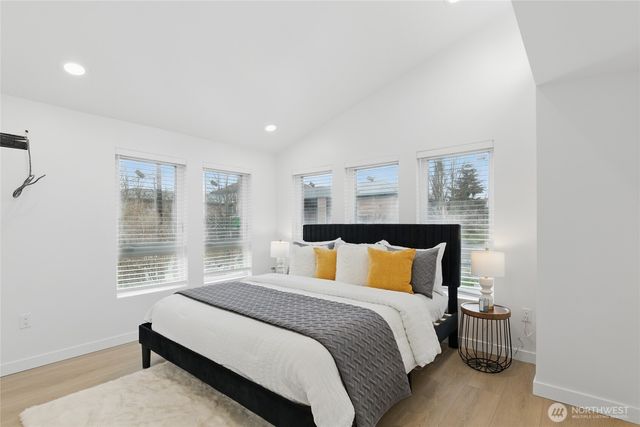 a bedroom with a bed and window