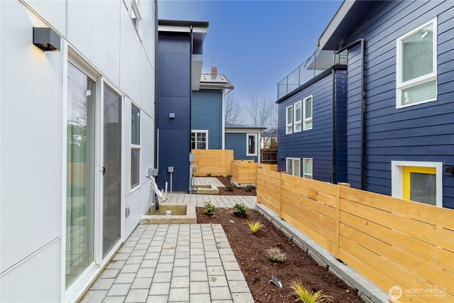 a view of a brick house with many windows