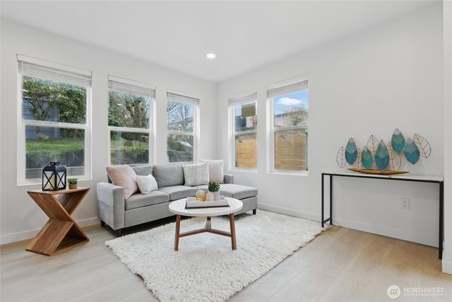a living room with furniture and windows