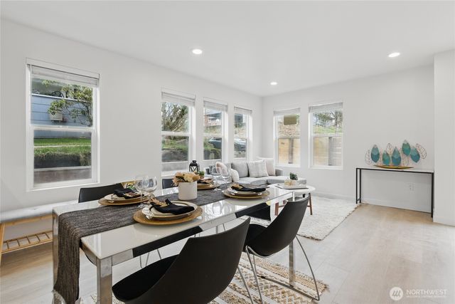 a view of a dining room with furniture window and outside view
