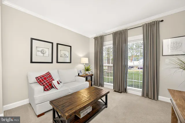 a kitchen with stainless steel appliances granite countertop a stove top oven a sink dishwasher a dining table and chairs with wooden floor