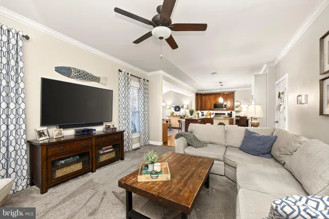 a living room with furniture and a lamp