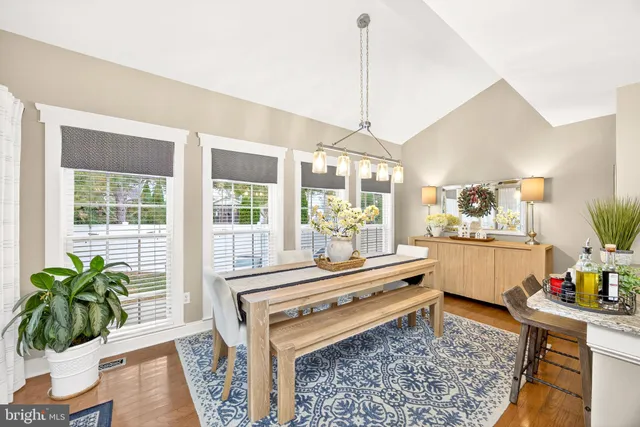 a living room with furniture and a lamp