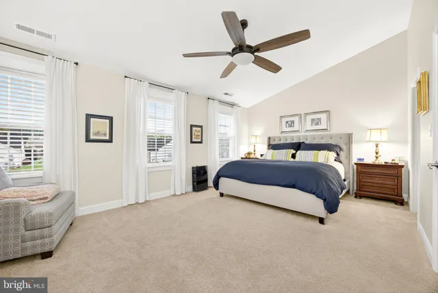 a bathroom with a sink and mirror with toilet