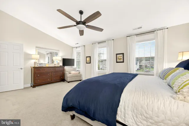 a bed room with a bed and a window