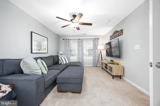 a view of a patio with a dining table and chairs with wooden floor and fence