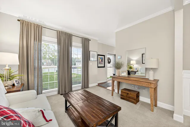 a kitchen with stainless steel appliances granite countertop a stove a sink dishwasher and a refrigerator with wooden floor