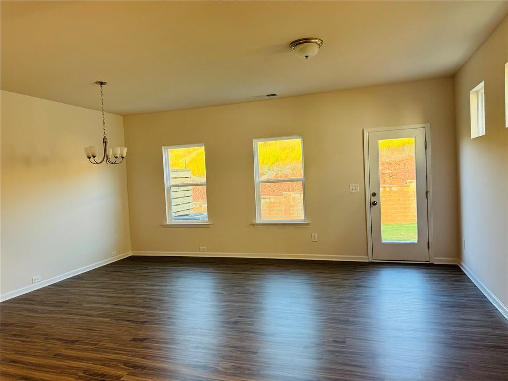 217 Dupont Drive Cartersville, GA 30121 - Photo 3 of 7 a view of empty room with wooden floor and fan