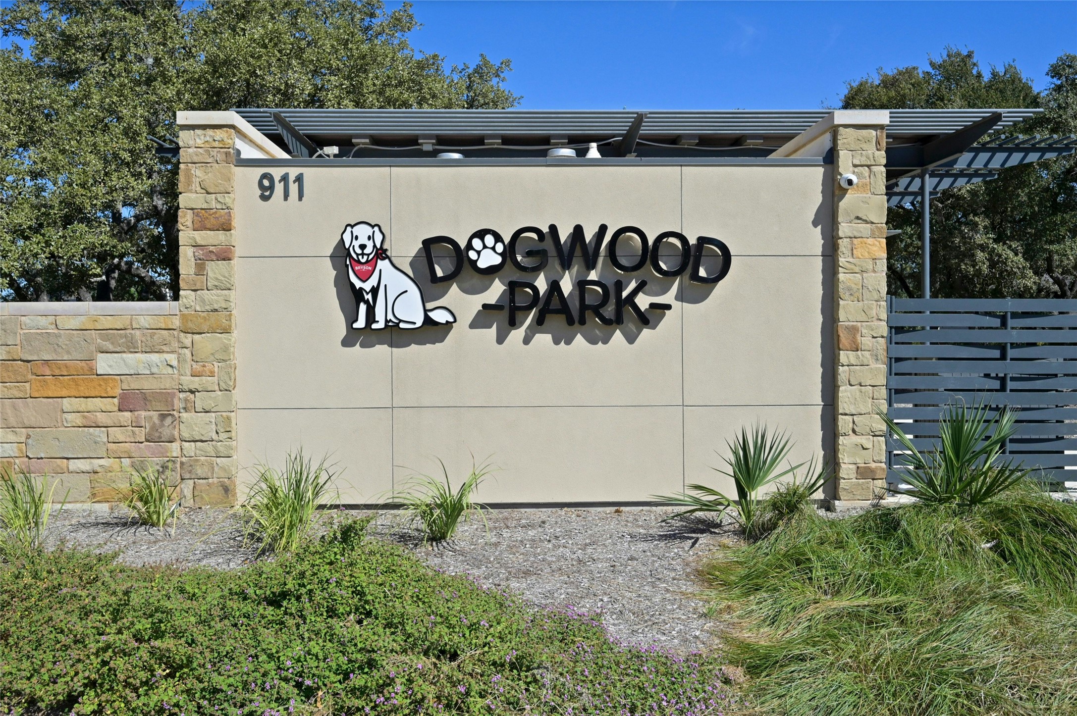 1140 Bryson Rdg Trail Leander, TX 78641 - Photo 36 of 39 Community amenity featuring a stone and stucco sign with three-dimensional lettering and a dog graphic