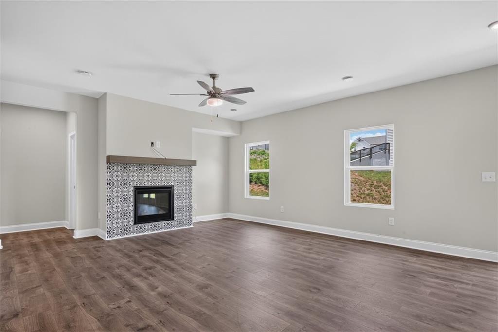 107 Ledgemont Way Acworth, GA 30101 - Photo 14 of 57 a view of an empty room with a fireplace and a window