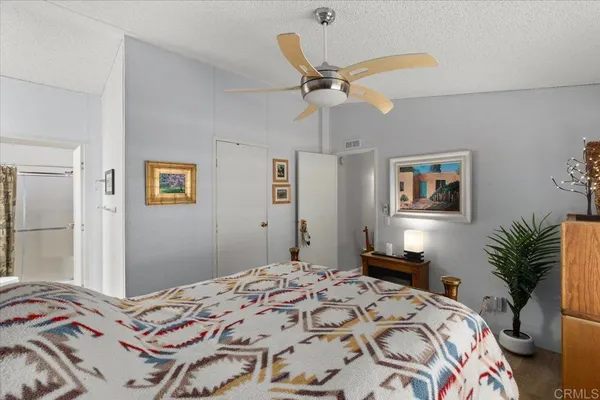 a bedroom with a bed and a dresser