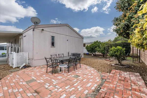 a view of a outdoor space with a patio and entertaining space