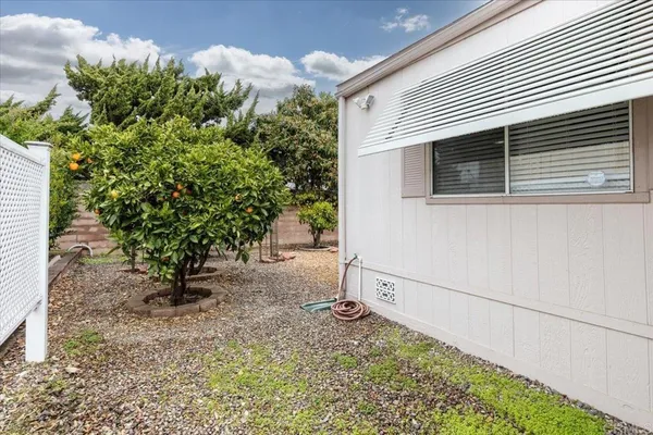 a backyard of a house with lots of green space