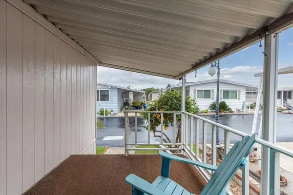 a view of a house with roof and sitting area
