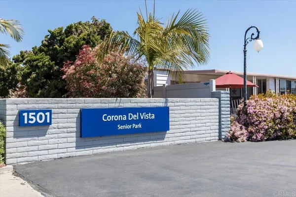 a view of a patio with a table and chairs
