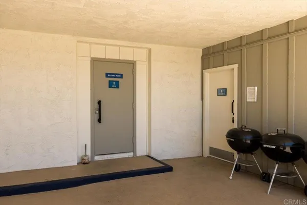 a view of a chair and table on the patio