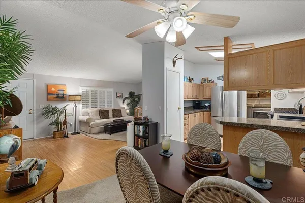 a living room with furniture and flat screen tv