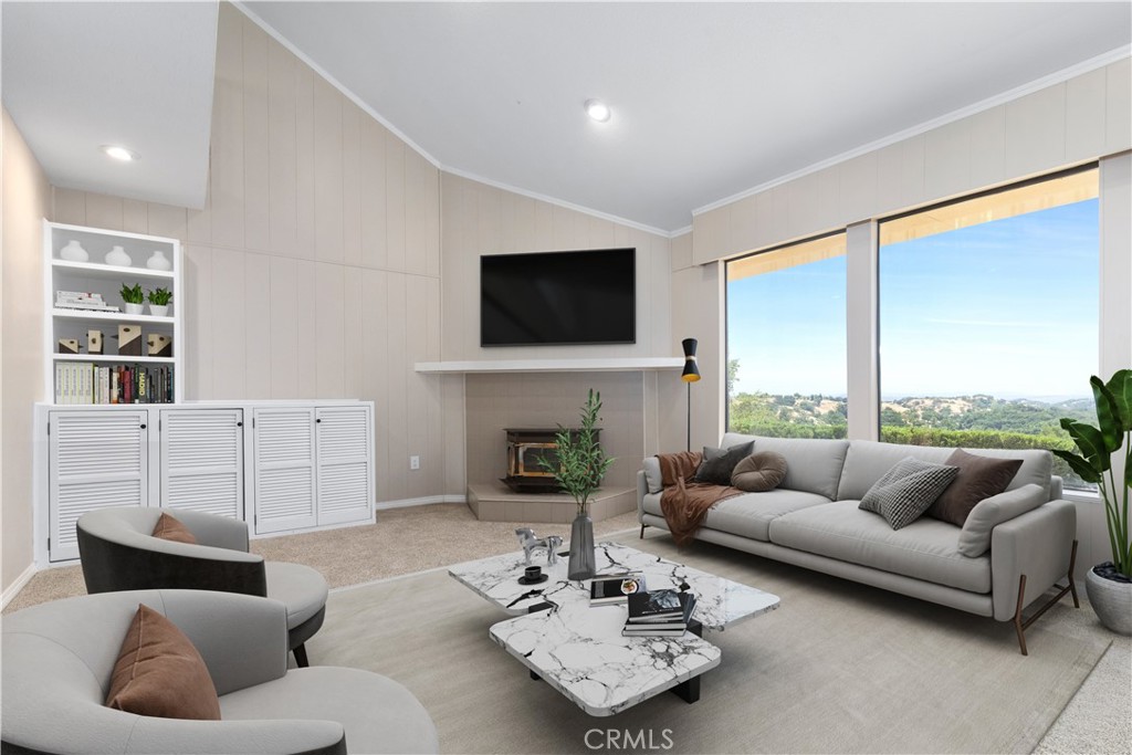 14220 El Monte Road Atascadero, CA 93422 - Photo 21 of 61 a living room with furniture a fireplace and a flat screen tv