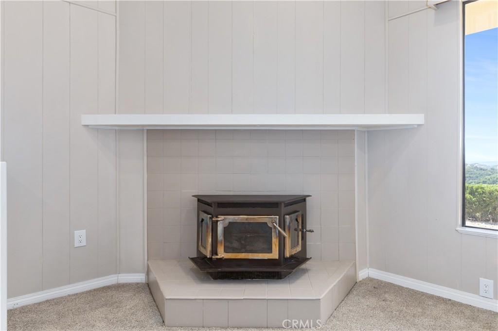 14220 El Monte Road Atascadero, CA 93422 - Photo 25 of 61 a living room with a fireplace