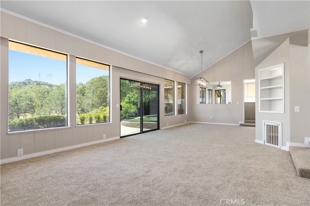14220 El Monte Road Atascadero, CA 93422 - Photo 26 of 61 a view of a big room with windows and chandelier fan