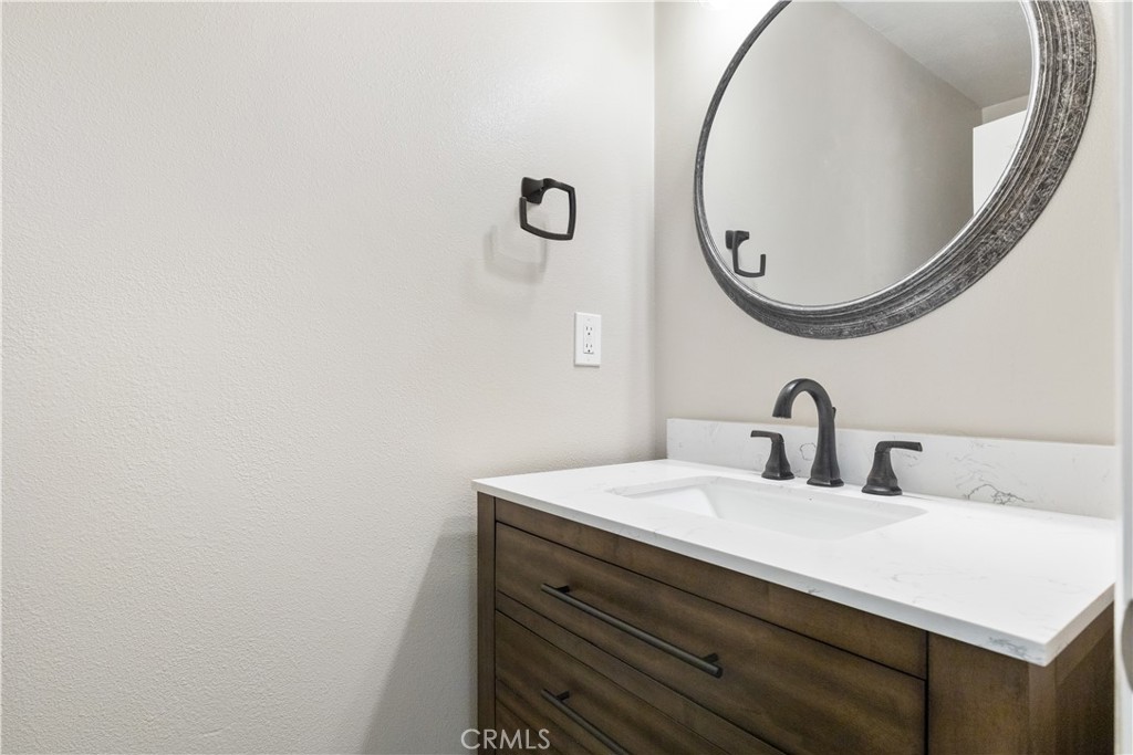 14220 El Monte Road Atascadero, CA 93422 - Photo 32 of 61 a bathroom with a sink and a mirror