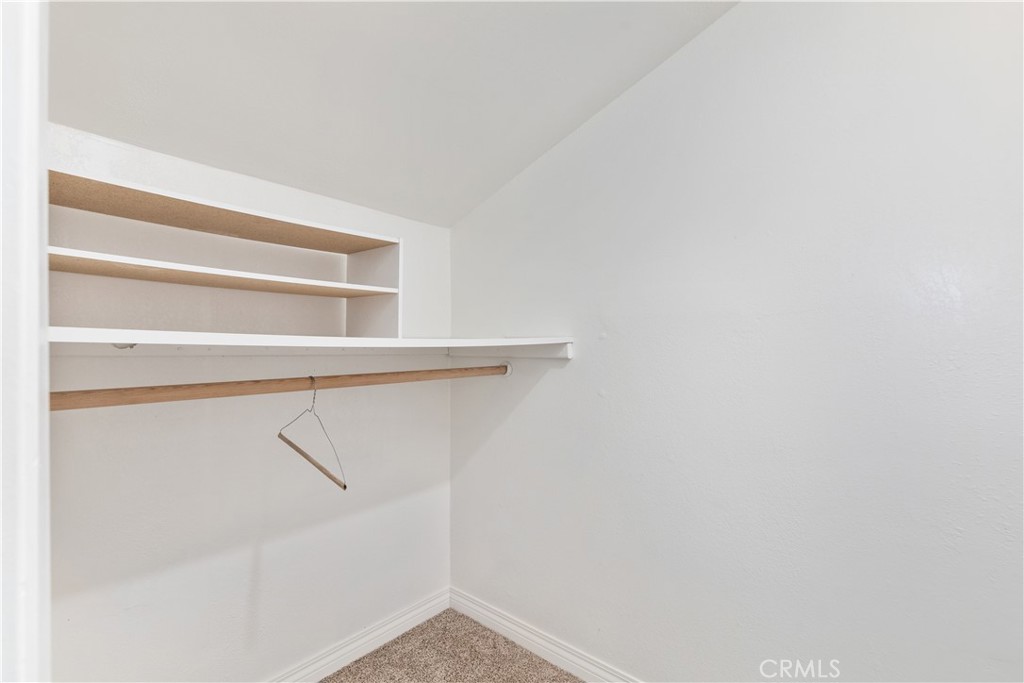 14220 El Monte Road Atascadero, CA 93422 - Photo 35 of 61 a view of walk in closet with empty racks