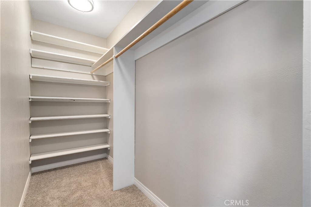 14220 El Monte Road Atascadero, CA 93422 - Photo 43 of 61 a view of walk in closet with empty racks