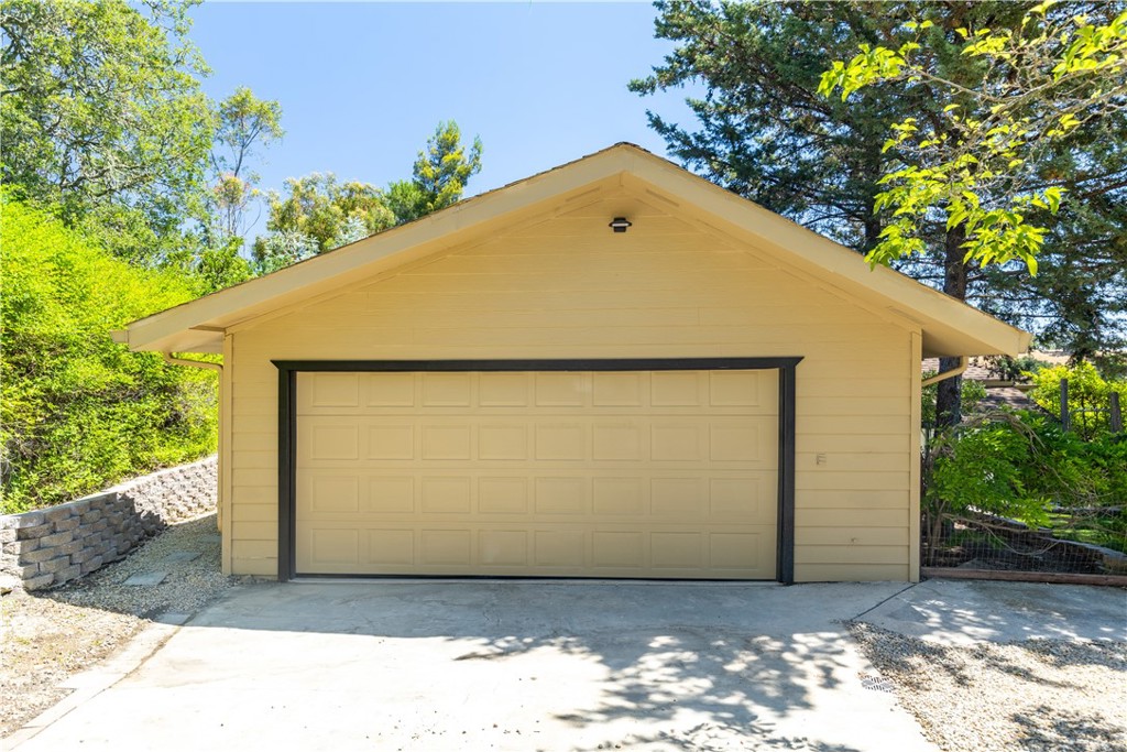 14220 El Monte Road Atascadero, CA 93422 - Photo 59 of 61 a view of backyard with large tree and wooden fence