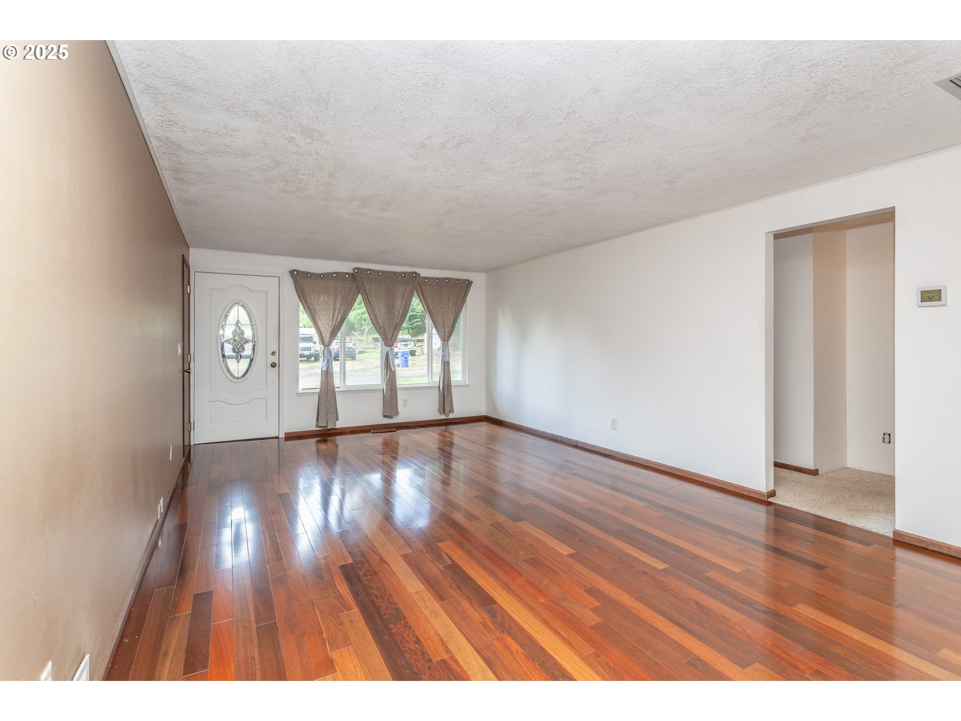 482 Southwest Nymph Road Estacada, OR 97023 - Photo 3 of 22 wooden floor in an empty room with a window