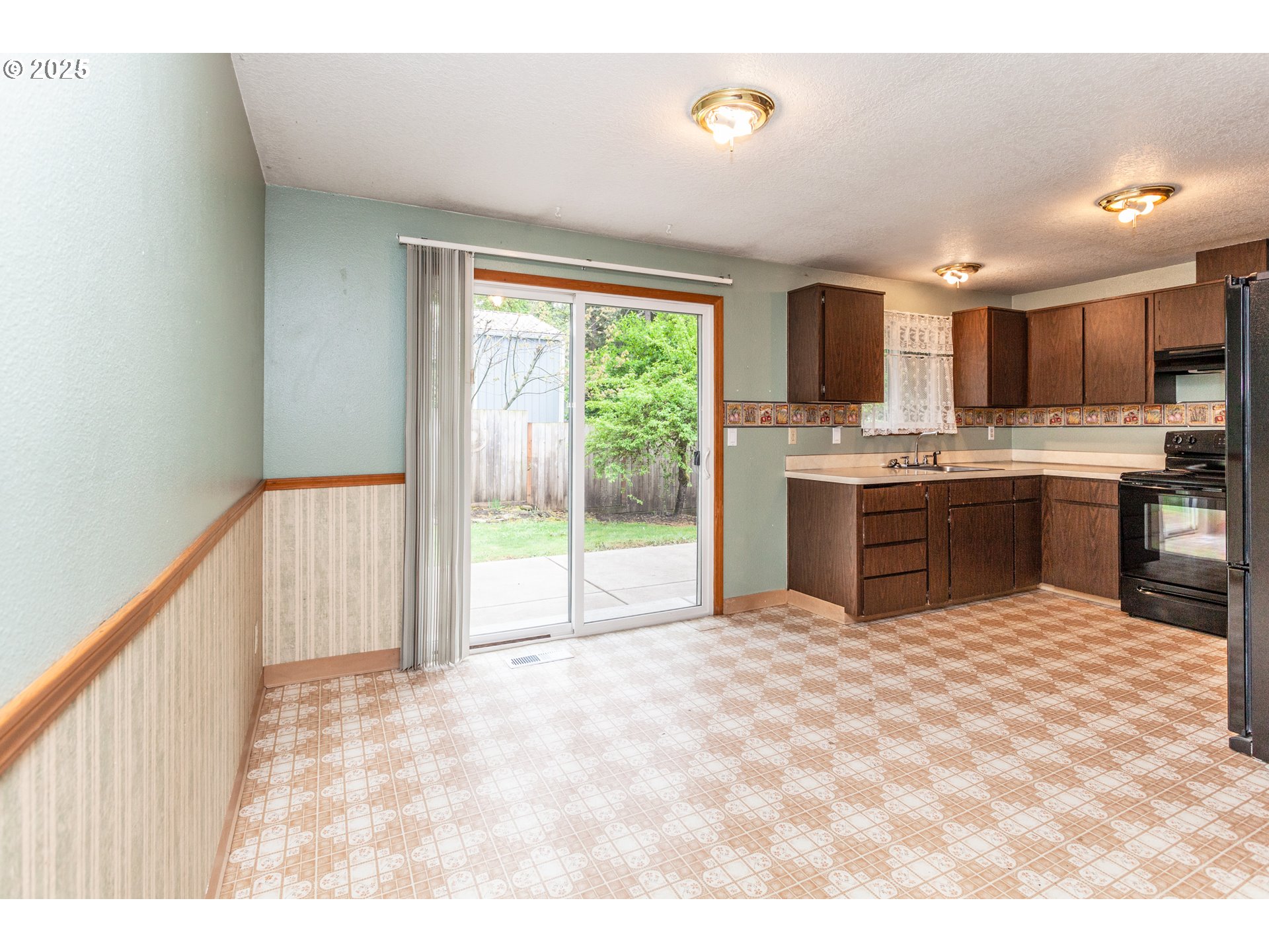 482 Southwest Nymph Road Estacada, OR 97023 - Photo 4 of 22 a view of kitchen with stainless steel appliances granite countertop a stove top oven a sink dishwasher a dining table and chairs with wooden floor
