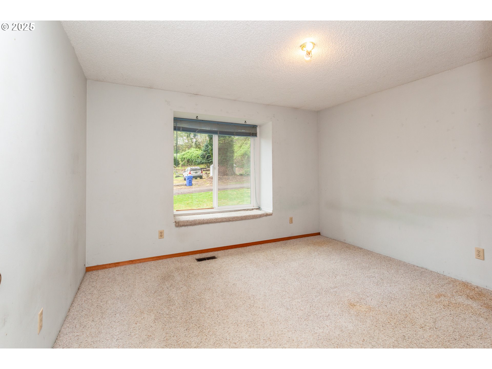 482 Southwest Nymph Road Estacada, OR 97023 - Photo 6 of 22 an empty room with windows