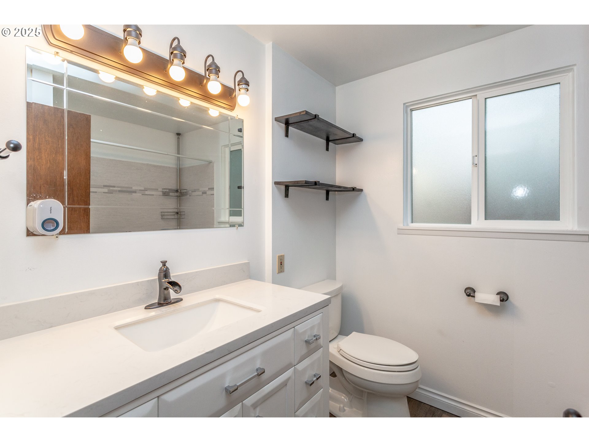 482 Southwest Nymph Road Estacada, OR 97023 - Photo 8 of 22 a bathroom with a sink vanity mirror and toilet