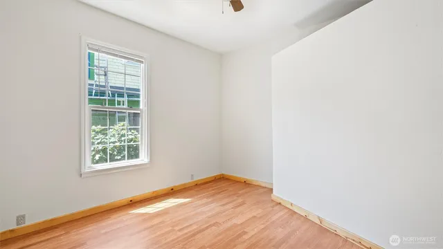 a view of room with wooden floor
