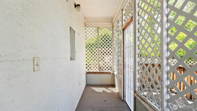 a view of backyard with deck and wooden floor