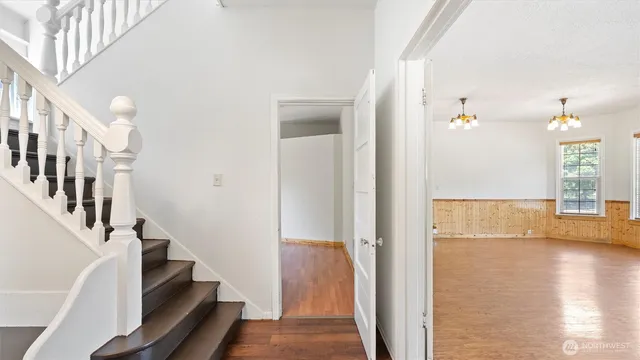 a view of an entryway with wooden floor