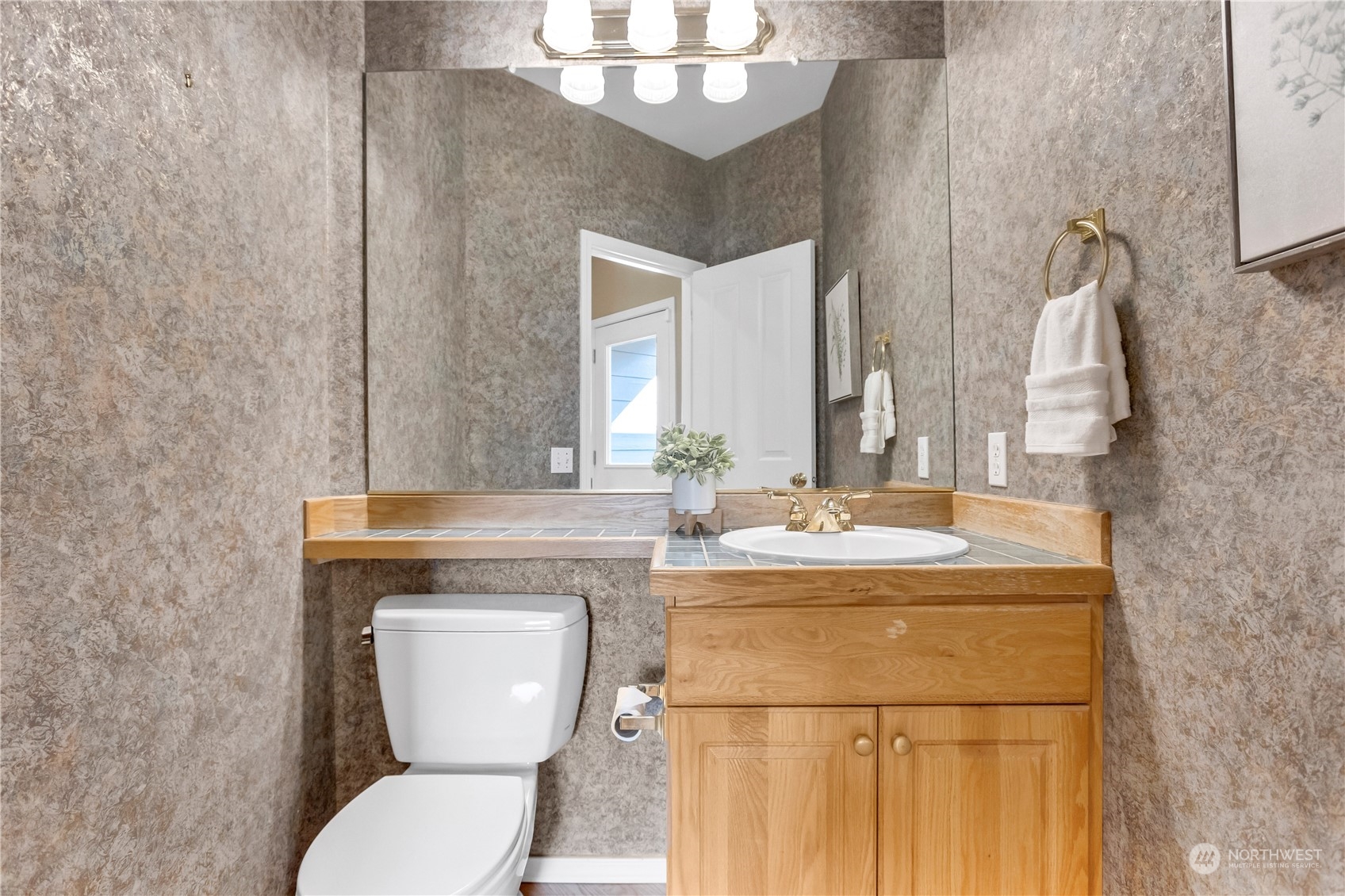 3210 187th Place Southeast Bothell, WA 98012 - Photo 11 of 39 a bathroom with a toilet a sink and mirror