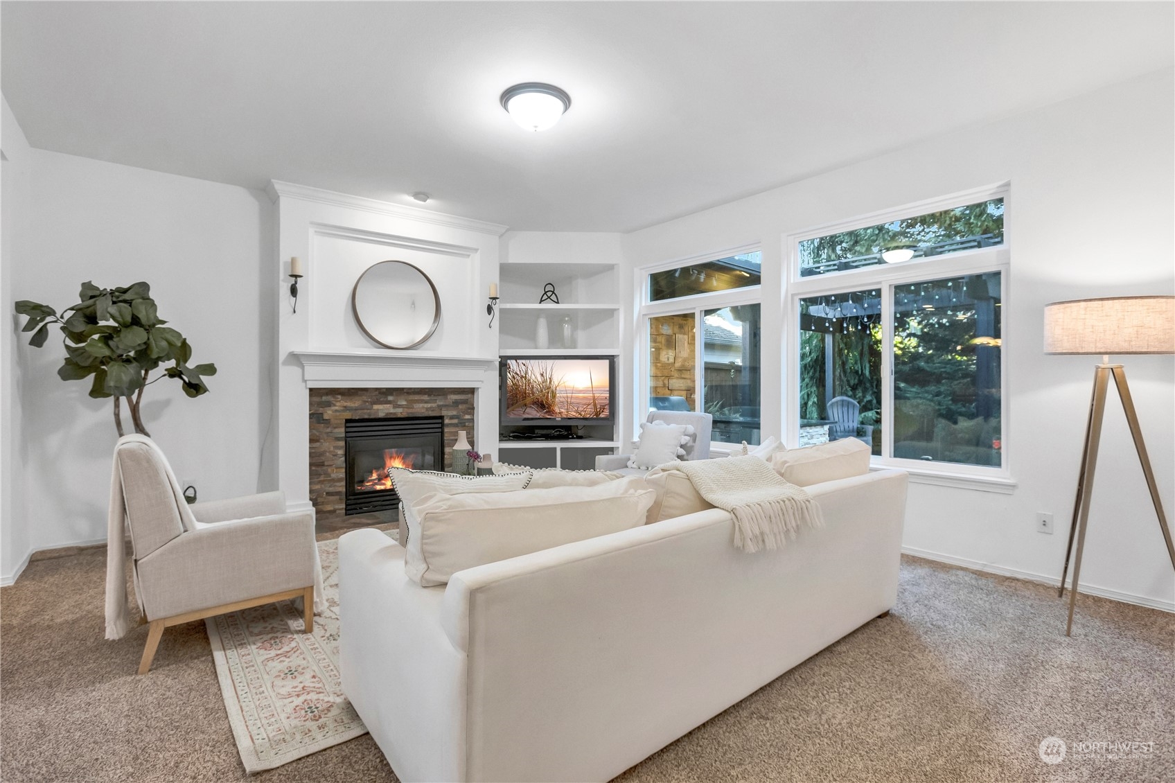 3210 187th Place Southeast Bothell, WA 98012 - Photo 13 of 39 a living room with furniture a fireplace and a large window
