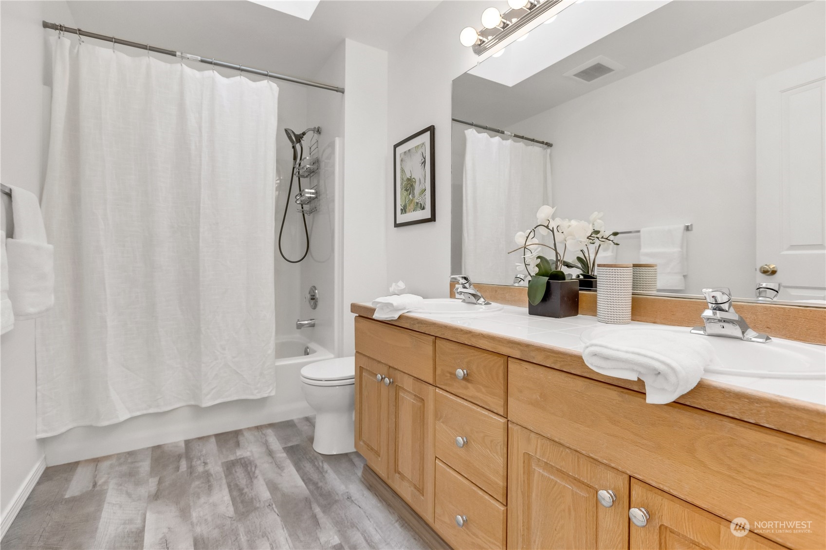 3210 187th Place Southeast Bothell, WA 98012 - Photo 26 of 39 a spacious bathroom with a double vanity sink toilet and a mirror